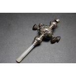 A 925 SILVER BABY'S RATTLE, with four bells, whistle and mother of pearl handle, L 10cm
