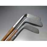 THREE VINTAGE HICKORY SHAFT GOLF CLUBS, three putters comprising a Standard Gold Co. 'The New Mills'