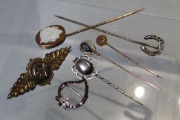 A COLLECTION OF ASSORTED WHITE METAL AND YELLOW METAL STICK PINS, to include a 9 ct gold example,