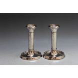 A PAIR OF HALLMARKED SILVER CANDLESTICKS - BIRMINGHAM 1942, having filled bases, H 135.5 cm