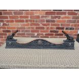 AN ART NOUVEAU CAST IRON AND COPPER FIRE FENDER, having various floral and organic embellishment,