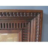 A LATE 19TH / EARLY 20TH CENTURY OAK DECORATIVE FRAME, with egg and dart design to outer edge and