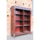 A LARGE ANTIQUE MAHOGANY OPEN BOOKCASE, with carved mask and figural detail, raised on paw feet, H