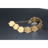 A BRACELET MADE OF EIGHT VICTORIAN SHIELD BACK HALF SOVEREIGNS, each having soldered links, dates