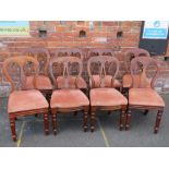 A MATCHED SET OF EIGHT VICTORIAN MAHOGANY DINING CHAIRS, shaped open backs above drop-in seats,