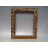 A 19TH CENTURY CARVED WOODEN DECORATIVE FRAME, frame W 4 cm, rebate 25 x 20 cm Condition Report: