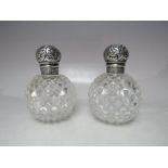 A PAIR OF HALLMARKED SILVER TOPPED SCENT BOTTLES - BIRMINGHAM 1888, makers mark for J.G. & S, of