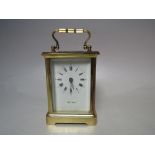 A PAUL LAVANT FRENCH BRASS CASED CARRIAGE CLOCK, the enamel face with Roman numerals and outer