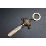 A HALLMARKED SILVER BABY'S 'BOY BLUE' TEETHER RATTLE - BIRMINGHAM 1935, with two bells and mother of