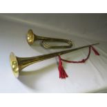 A BRASS HERALDIC TRUMPET TOGETHER WITH A MILITARY LONG BUGLE BY HENRY POTTER, ALDERSHOT (2)