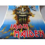 A VINTAGE IRON MAIDEN 'THE EVIL THAT MEN DO' POSTER, together with a selection of posters comprisin