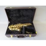 A KOHLERT STUDENT MODEL ALTO SAX WITH FITTED CASE, having a lacquered brass body and mother of pea