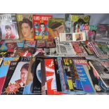 A LARGE COLLECTION OF MODERN AND VINTAGE ELVIS PRESLEY MAGAZINES, SCRAPBOOKS AND MEMORABILIA, to in