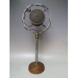 A BRITISH THOMSON HOUSTON MOVING COIL MICROPHONE NO. D10330, having a cast iron circular base and t
