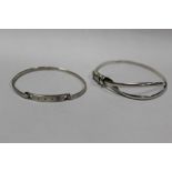 TWO STERLING SILVER BANGLES TO INCLUDE A DESIGNER STYLE EXAMPLE APPROX WEIGHT - 23.6G