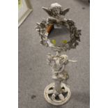 A MODERN CAST METAL CHERUBIC MIRROR ON STAND HEIGHT - 70CM