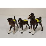 TWO BESWICK FOALS TOGETHER WITH A DOULTON EXAMPLE (3)