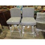 A PAIR OF MODERN UPHOLSTERED GREY SWIVEL BAR STOOLS