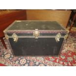 A VINTAGE BLACK PACKING TRUNK