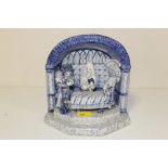 A VINTAGE BLUE AND WHITE CERAMIC DIORAMA OF AN INTERIOR SCENE WITH FIGURES