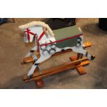 A WOODEN ROCKING HORSE