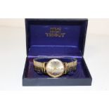 A 9 CARAT GOLD BOXED TISSOT SEASTAR SEVEN WRIST WATCH