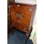 A REPRODUCTION WALNUT DRINKS CABINET ON CABRIOLE SUPPORTS