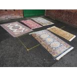 A COLLECTION OF FIVE ASSORTED MODERN WOOLLEN RUGS