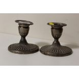 A PAIR OF HALLMARKED SILVER CANDLESTICKS HEIGHT - 10CM