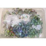 A BOX OF VINTAGE MARBLES
