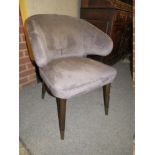 A MODERN UPHOLSTERED TUB STYLE CHAIR