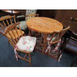 A MODERN CIRCULAR PINE TABLE AND FOUR CHAIRS