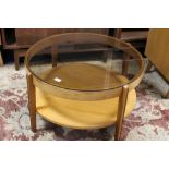 A RETRO TEAK AND GLASS 'REMPLOY' CIRCULAR COFFEE TABLE DIA. 82 CM