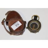 A LEATHER CASED MILITARY 1918 FIELD COMPASS