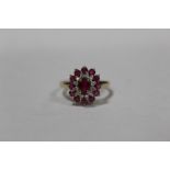 A HALLMARKED 9 CARAT GOLD DRESS RING SET WITH RUBY STYLE STONES, RING SIZE P, APPROX WEIGHT 2.3G