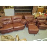 A MODERN BROWN LEATHER STYLE THREE PIECE SUITE - NOTE TWO ARMCHAIRS ELECTRIC