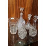 A COLLECTION OF CUT GLASS DECANTERS ETC. TOGETHER WITH A ROYAL DOULTON CRYSTAL SWIRL EFFECT CUT