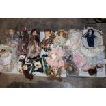 A LARGE BOX OF PORCELAIN HEADED DOLLS - APPROX 25
