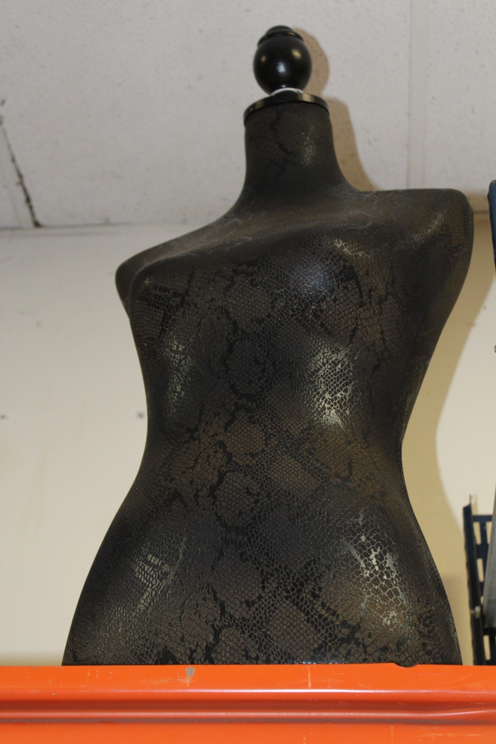 A MODERN SNAKESKIN EFFECT MANNEQUIN TORSO