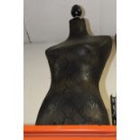 A MODERN SNAKESKIN EFFECT MANNEQUIN TORSO