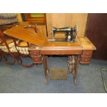 A VINTAGE OAK SINGER TREADLE SEWING MACHINE