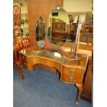 A WALNUT DRESSING TABLE WITH TRIPLE MIRROR