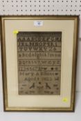 A FRAMED AND GLAZED ANTIQUE SAMPLER BY MARY A ELLIOTT 1823