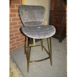 A MODERN UPHOLSTERED QUILTED BAR STOOL