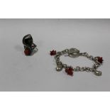 A SILVER CHARM BRACELET. TOGETHER WITH A SILVER DRESS RING APPROX WEIGHT 35.5G