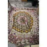 A VINTAGE HAND STITCHED PATCHWORK BLANKET