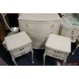A CREAM LOUIS XV STYLE FOUR DRAWER SERPENTINE CHEST AND TWO BEDSIDE CABINETS