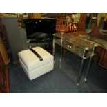 A CELCUS 31" FLATSCREEN TV AND STAND - REMOTE, WITH ANOTHER TV STAND AND A WHITE STOOL (4)