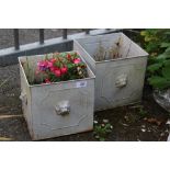 TWO SMALL METAL SQUARE PLANTERS WITH LION DETAIL, PLUS CONTENTS