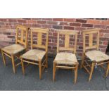 A SET OF FOUR CHURCH/SCHOOL STYLE WICKER SEAT CHAIRS ( ONE WITH BOOK TROUGH )